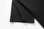 Black short-sleeve crew-neck T-shirt hem view